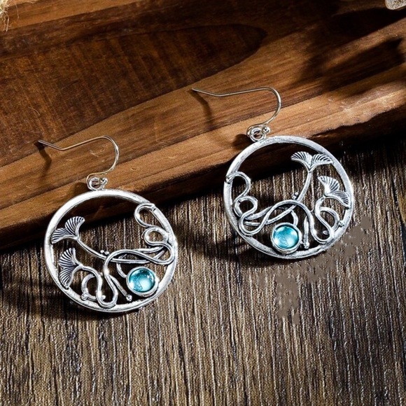 GlitzBlitz Boutique Jewelry - Any 2/$20! Silver Iridescent Blue Gem Circular Drop Earrings